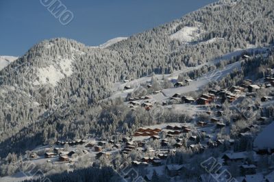 New snow on chalets in village