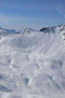 Cubere ski lift with ski tracks