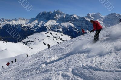 Red skiers  with Dents du Midi