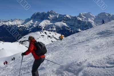 Red and yellow skiers