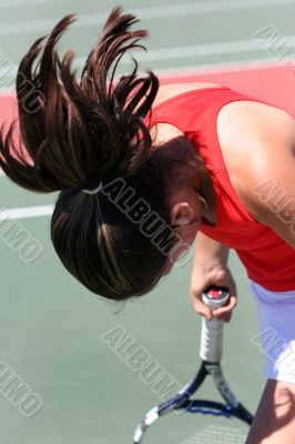 Teenage Girl Playing Tennis