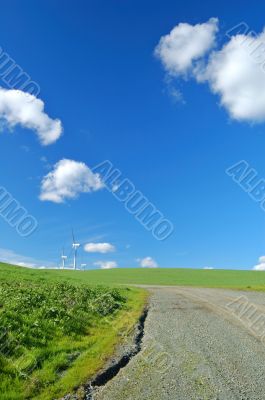 road, windmills, and field