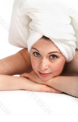 Laying girl in towel