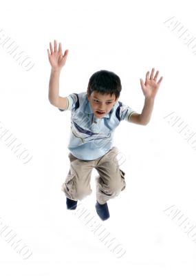  Young boy jumping up isolated on white