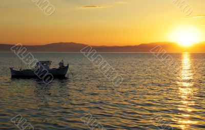 Fishing boat at sunset