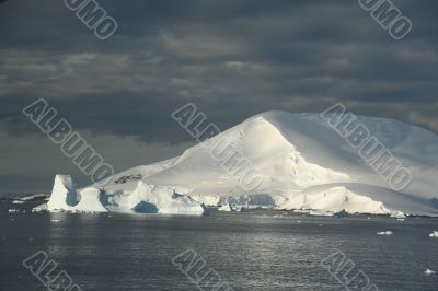 Icebergs and snow covered mountain