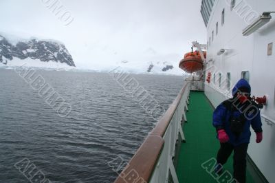 Tourists on promenade deck of cruise ship