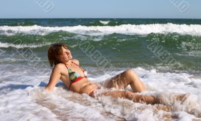 girl relaxing in the waves