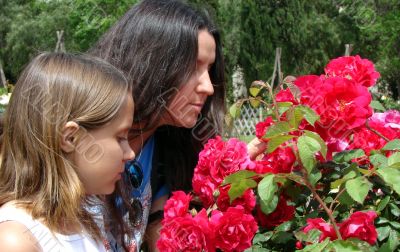 mum with a daughter in botanical to a garden.