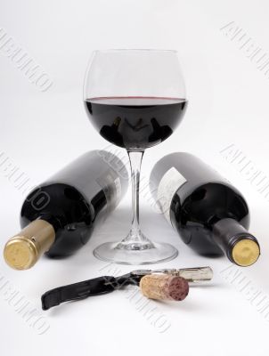 Wine bottles and a glass of red wine