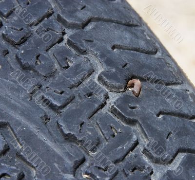 Tire with a nail