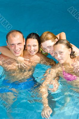 attractive people having fun in a pool