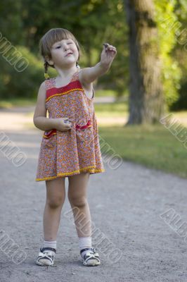 Girl appreciating whe stone she holding