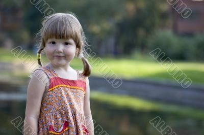 Pretty little girl in park