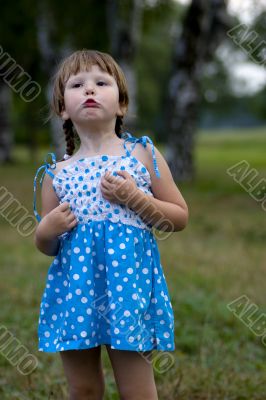 Displeased grimasing little girl