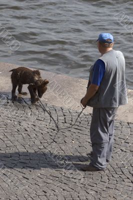 Russian man with pet bear on the street