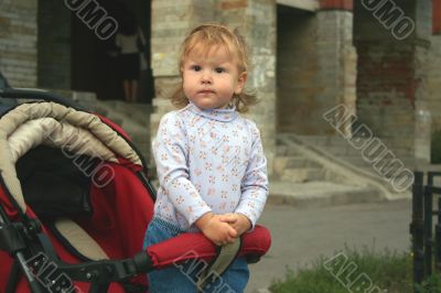 Baby standing in pram