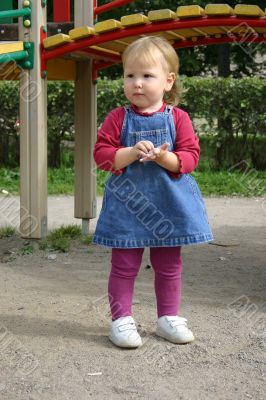 Toddler girl playing in patio