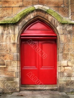 Red doors of the old stone cathedral