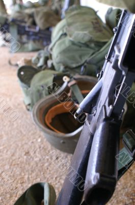 a rifle and a soldier helmet