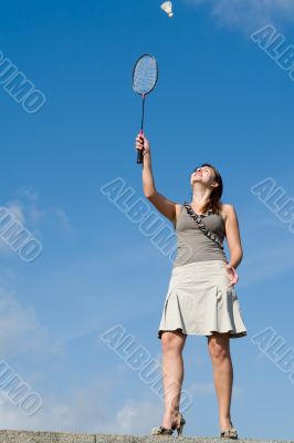 woman playing badminton