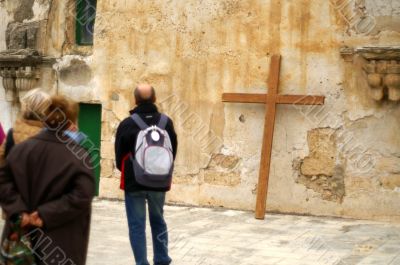 pilgrim with a cross in  jerusalem