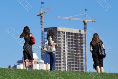 Girls watching the construction