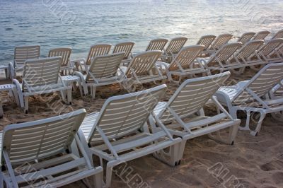 Chaise-longues in sunset