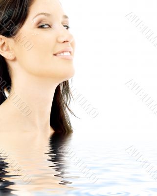 smiling brunette with diamond make-up in water