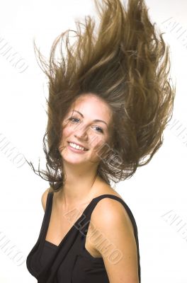 The beautiful girl with fluttering hair