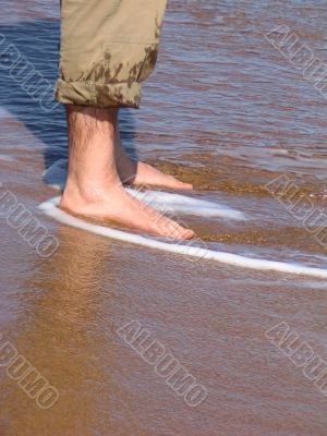 Man barefood on the beach