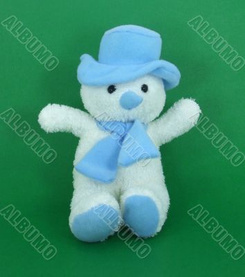 Snowman with Blue Hat and Scarf on Green