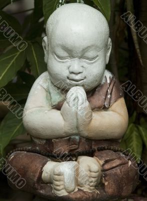 Praying child sculpture
