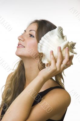 Portrait of the beautiful girl with a cockleshell