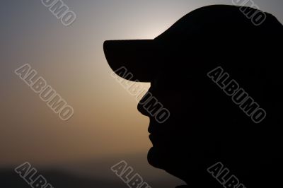 man with cap silhouete