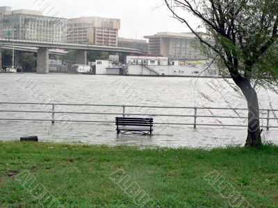 stormy weather - submerged park bench