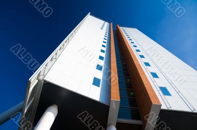 bright white office tower building wide angle view