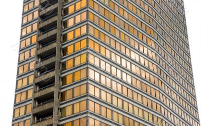 isolated office tower with golden windows