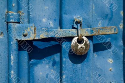 Steel lock on blue freight container