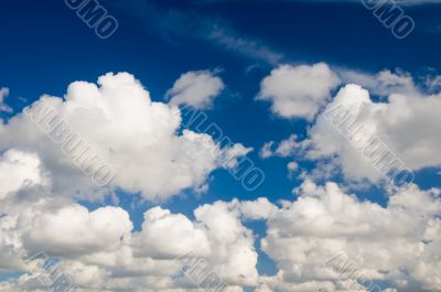 Cloudscape. White clouds in the blue sky.