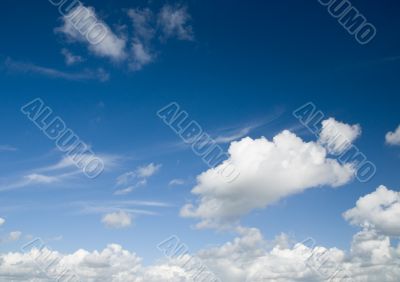 Cloudscape. White clouds in the blue sky.