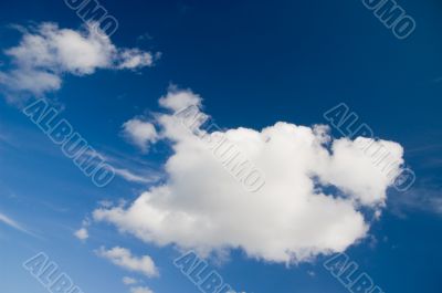 Cloudscape. White clouds in the blue sky.