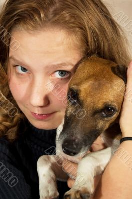 joung woman holding a jack russel