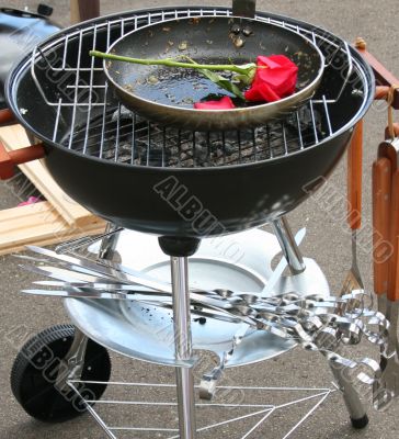 Barbecue grill and rose
