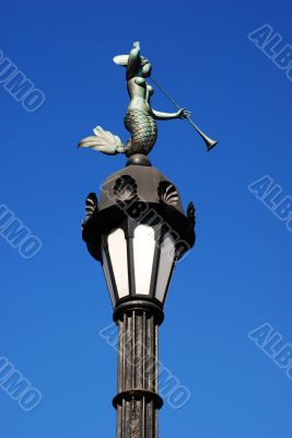 Old lamp post with mermaid