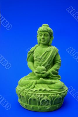 Green buddha, blue background.
