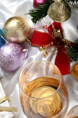 Glass of white wine on a beautiful christmas background