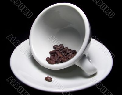 Cup Of Coffee Beans On Saucer