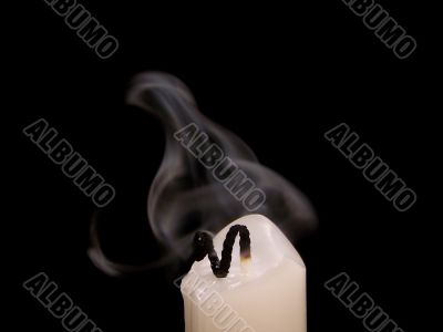 Extinguished Candle With Smoke Above It