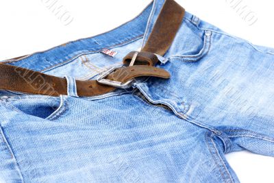 Female jeans with leather belt.